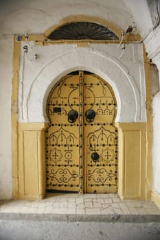 Africa,North Africa,Tunisia,Tunis,Capital,Old Town,Architecture,Souq,Market,Bazaar,Trade,Economy,Everyday,Tuer,Gate,Entrance,Medina.A wooden tin in traditional Souq or market or Bazaar in the old town or medina of the capital Tunis in the north of Tunisia