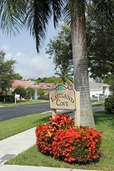OAKLAND PARK, FLORIDA - JULY 1, 2013: Entrance sign to Eastland Cove, a relaxing, suburban neighborhood in west Oakland Park, Florida on a sunny tropical day in Broward County.