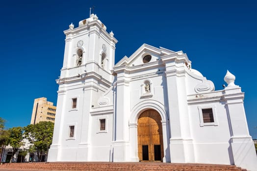 White cathedral of Santa Marta, Colombia with a beautiful deep blue sky