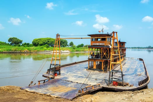 Old historic ferry waiting to take passenger along the Magdalena River to and from Mompox, Colombia