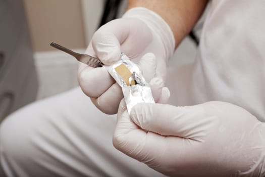 Scalpel blade in the packaging