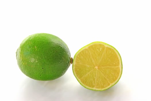 Lime,whole and halved fruit