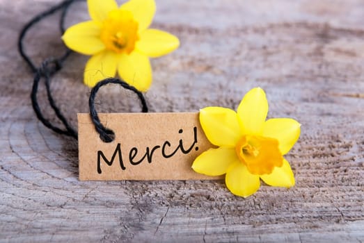 Label with the French Word merci which means Thanks
