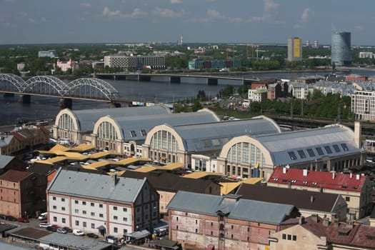 The district of Small Moscow on the Daugava River with the market and market halls of Riga from the view of the view terrace of the Socialist High-Rise Academy of Sciences in the district of Little Moskov in Riga,Latvia