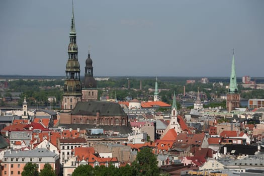The Old Town with the Cathedral and the St. Peter's Church from the view of the view of the Socialist High-Rise Academy of Sciences in the Little Moskow district in Riga,Latvia