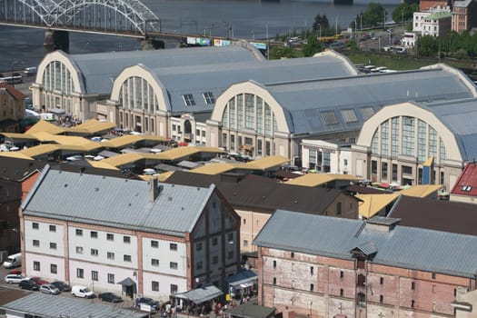 The district of Small Moscow on the Daugava River with the market and market halls of Riga from the view of the view terrace of the Socialist High-Rise Academy of Sciences in the district of Little Moskov in Riga,Latvia
