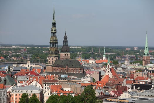 The Old Town with the Cathedral and the St. Peter's Church from the view of the view of the Socialist High-Rise Academy of Sciences in the Little Moskow district in Riga,Latvia