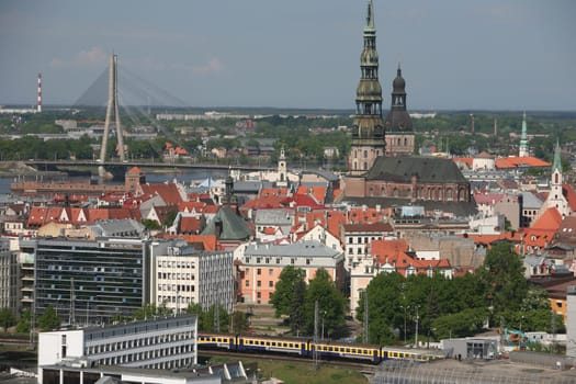The Old Town with the Vansu Bruecke and the Cathedral as well as the River Daugava from the view of the view of the Socialist High-Rise Academy of Sciences in the district of Little Moskow in Riga,Latvia