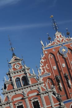 The St. Peter's Church and the Black House in the Old Town of Riga,the main city of Latvia in the BalticS in Eastern Europe.