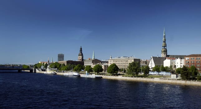 The St. Peter's Church and the Daugava River in the Old Town of Riga,the main city of Latvia in the Baltics in Eastern Europe.