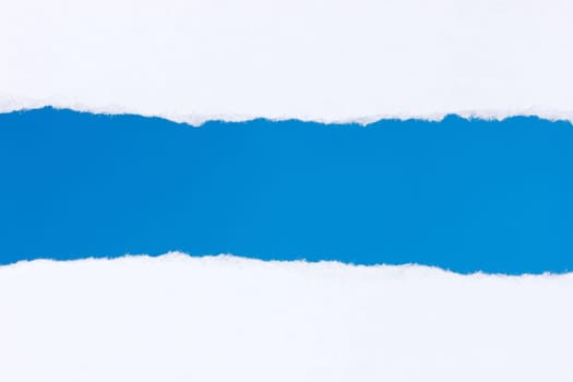 Torn white paper with a blue background for your text.
