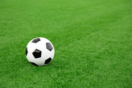 Traditional soccer ball on soccer field