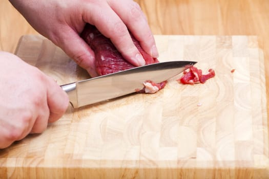 Prepare a piece of beef fillet with a knife