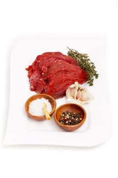 Beef fillet with herbs and spices on plate