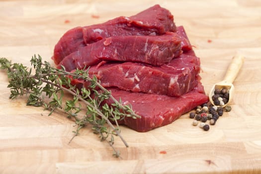 Beef fillet with thyme branch and peffer grains