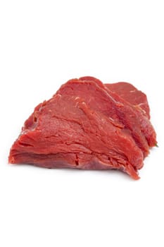 Piece of raw beef fillet isolated against a white background