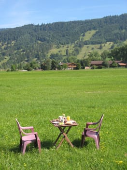 Breakfast table in front of Aufacker,Ammergau Alps,Upper Bavaria,Germany
