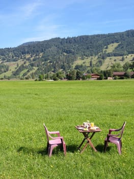 Breakfast table in front of Aufacker,Ammergau Alps,Upper Bavaria,Germany