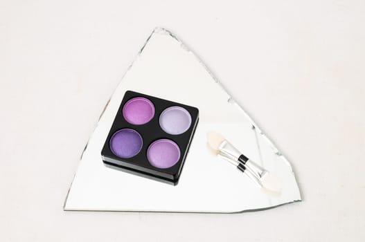 Make-up Palette Of Colorfully Eyeshadows Over White Background
