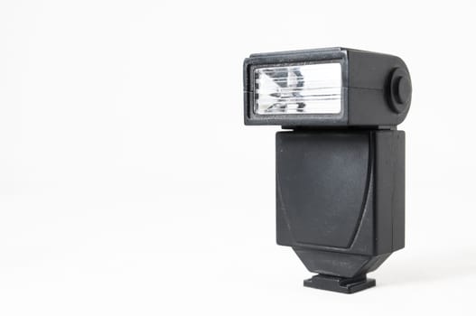 Black Photo Camera Flash on a White Background