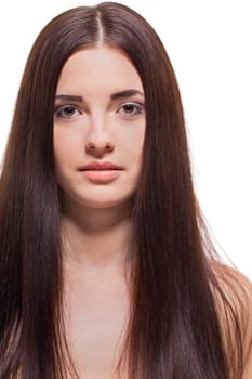 attractive young woman with long dark hair and beautiful healthy skin isolated portrait