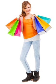 young laughing woman with colorful shopping bags shopping portrait isolated