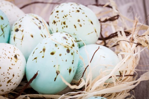 colorful bright easter eggs in a basket on a wooden table Easter decoration need spring festive