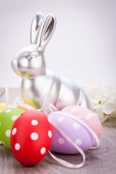 Colourful yellow and red Tulip with Easter eggs decorated at Easter with text space on green background