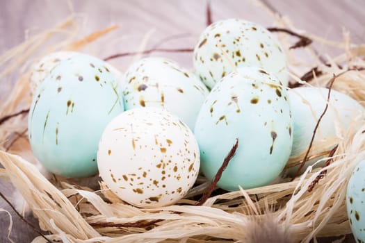 colorful bright easter eggs in a basket on a wooden table Easter decoration need spring festive