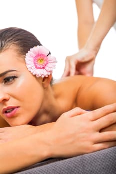 young woman relaxes during a back massage at salon wellness spa health therapy