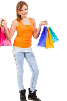 young attractive laughing woman isolated on shopping tour with colorful shopping bags