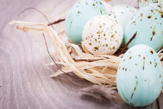colorful bright easter eggs in a basket on a wooden table Easter decoration need spring festive