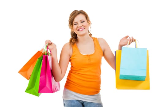 young attractive laughing woman isolated on shopping tour with colorful shopping bags