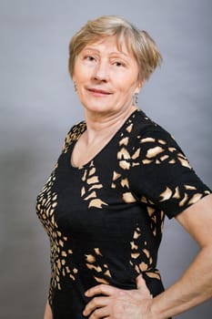 older adult woman seniorwith grey hair and wrinkle swelling healthy portrait in front of gauem background