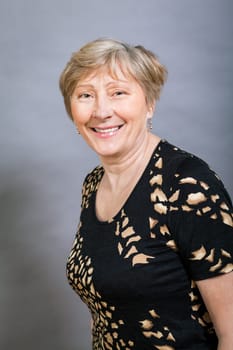 older adult woman seniorwith grey hair and wrinkle swelling healthy portrait in front of gauem background