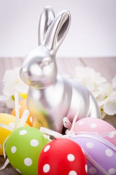 Colourful yellow and red Tulip with Easter eggs decorated at Easter with text space on green background