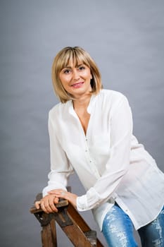adult attractive woman in middle age portrait against gauem background