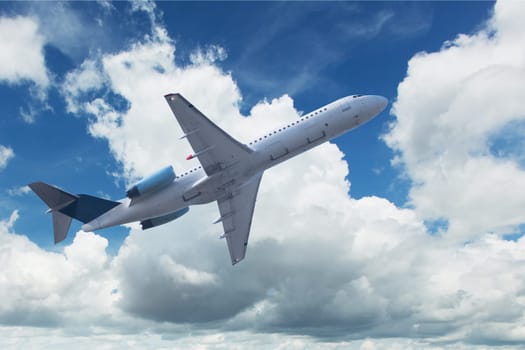 Plane with spring clouds,take off on holiday