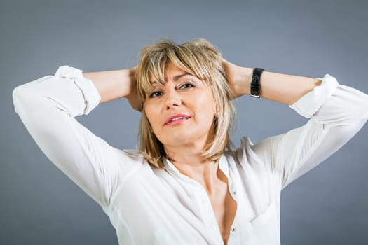 adult attractive woman in middle age portrait against gauem background