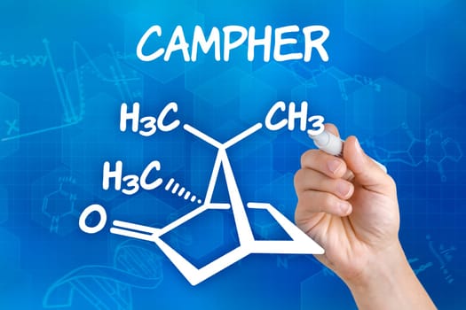 Hand draws chemical structural formula from Campher