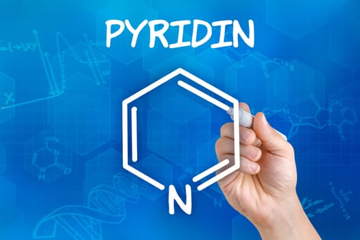 Hand draws chemical structural formula of pyridine