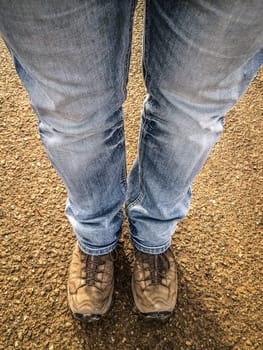Two tightly standing legs that look on the street.