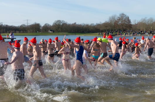 Traditional new years dive in Wierden, Netherlands. Each year there are over 200 locations in the country where people can take a dive in the ice cold water on january 1.