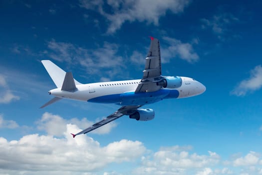 Plane in the sky,daylight with spring clouds
