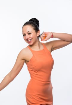 Portrait of beautiful caucasian woman wearing orange dress happy and full of energy