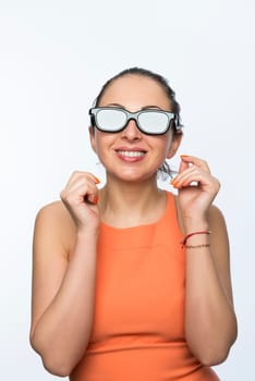 Portrait of beautiful caucasian woman wearing large 3D cinema glasses and smiling