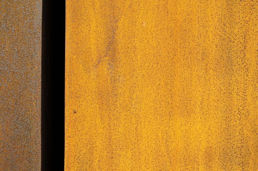 Orange Patterns on Rusty Surface of the Metal