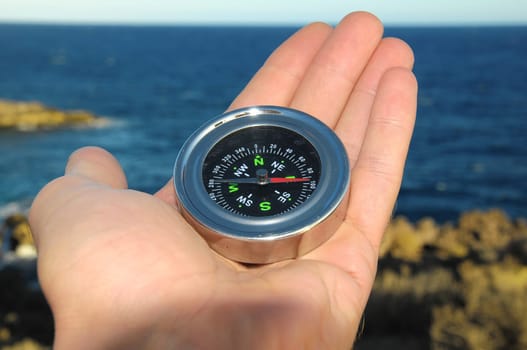 Orientation Concept a Male Hand Holding Metal Compass