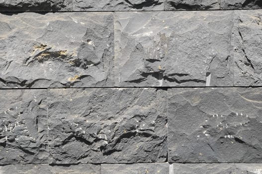 Black Lava Brick Texture on a Sunny Day
