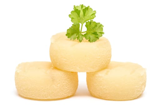 Harz cheese with parsley against a white background